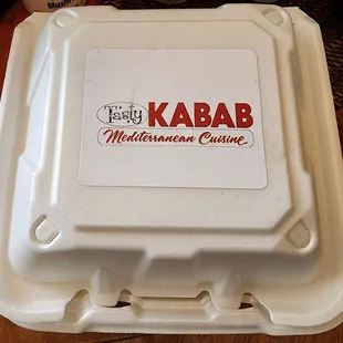 a takeout box on a table