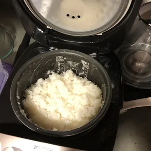 rice being cooked in a rice cooker