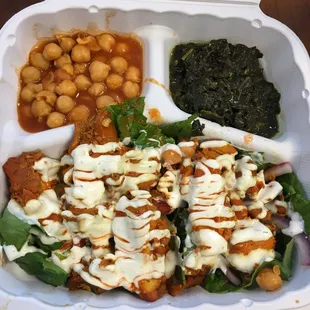 Chicken over salad with chickpeas and spinach