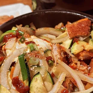 a bowl of stir fried vegetables