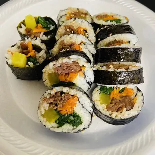 a plate of sushi rolls