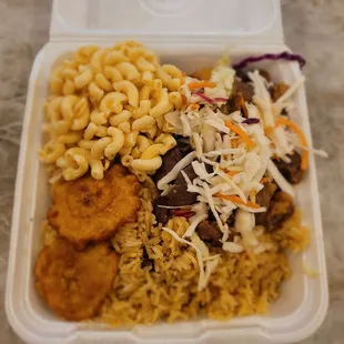 Rice and beans, plantains, macaroni salad, and fries pork. Amazing!!!!