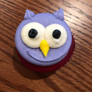 a purple owl cupcake