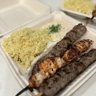 Mixed Grill 3 with 2 Shish Kafta (ground beef) and 1 Shish Tawook (chicken), side of rice and Mtable.