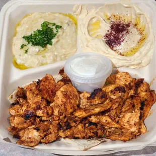 Mtable, Hummus, Chicken Shawarma with a container of Toum (Garlic sauce). Delicious!