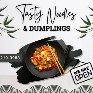 a plate of food with chopsticks