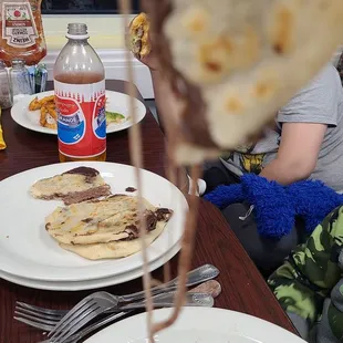 a slice of pizza being held by a fork