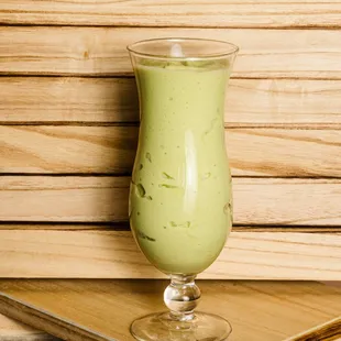 a green drink in a glass