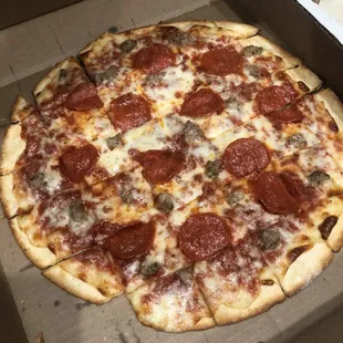 a pepperoni pizza in a box