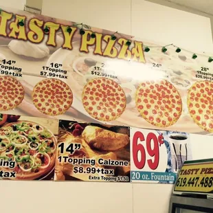 a variety of pizzas on display