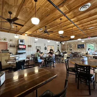 a dining area with tables and chairs