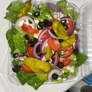 a salad in a plastic container