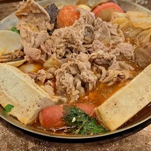 Stinky Tofu Hot Soup. 2 of 3 pieces of fermented tofu in front.