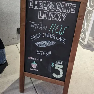 a sign for a cheesecake lover