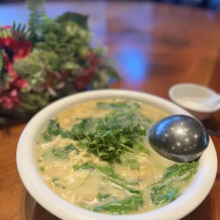 a bowl of soup with a spoon