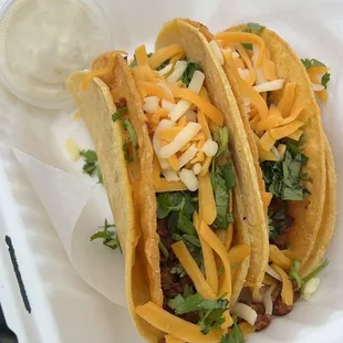 two tacos in a styrofoam container
