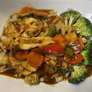 a plate of chicken and vegetables