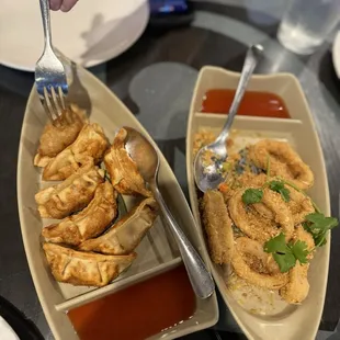 Potstickers ($7.99) and Spicy Garlic Calamari ($14.59)