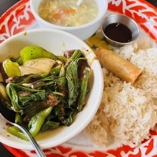 a plate of food with rice and vegetables