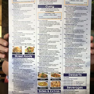 a person holding a menu