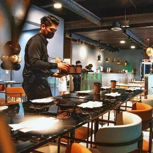 a man preparing food in a restaurant