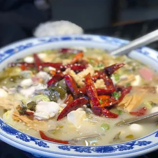 a bowl of soup with a spoon