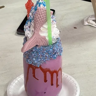 a mermaid milkshake on a plate