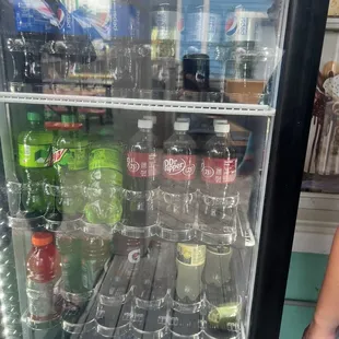 a refrigerator full of soft drinks