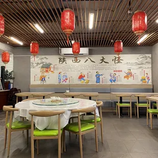 a dining area with tables and chairs