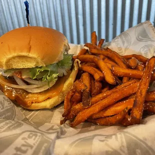 a burger and sweet potato fries