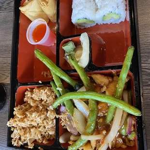 a bento box of food