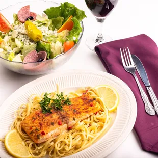 a plate of pasta and a glass of wine