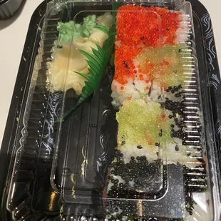 a sushi dish in a plastic container