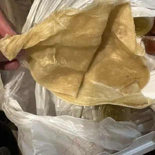 Entire edge of flower tortilla was hard like it also was siting. I live 8 mins from the restaurant.