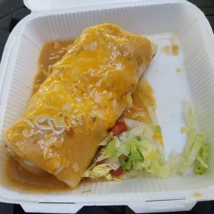 Breakfast burrito w/ chicharrones. Smothered deluxe