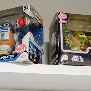 two star wars action figures on a shelf