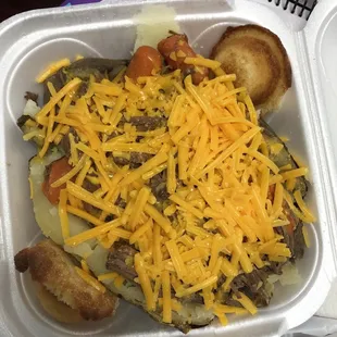 Pot roast potato with shredded cheese. Carrots were full of flavor and soft, but not mushy.
