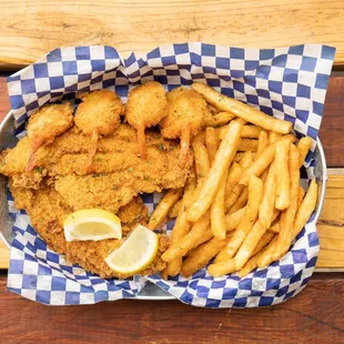 a basket of fried fish and french fries