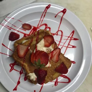 Stuffed French toast with strawberries and raspberries topping