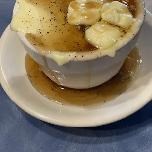 Cup of grits with cheese and butter and syrup