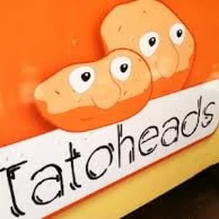 tatoheads on the side of the truck