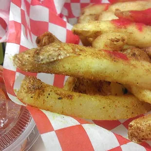 detail of curry fries with cilantro roasted red pepper ketchup