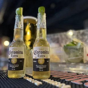 two bottles of corona extra