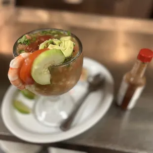 a hand holding a cocktail