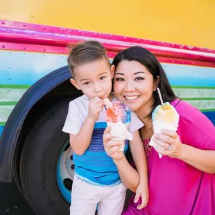 a woman and a boy eating ice cream