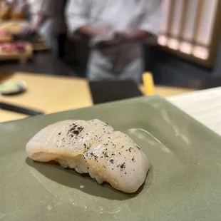 Scallop with charcoal salt