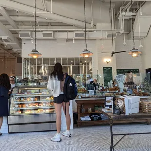 two women standing in front of the counter