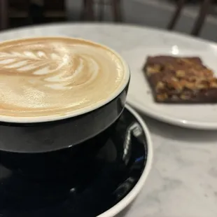 House latte with a walnut brownie