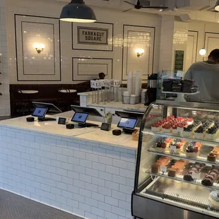 a counter with a variety of desserts