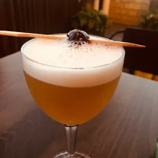 a drink with a toothpick sticking out of it